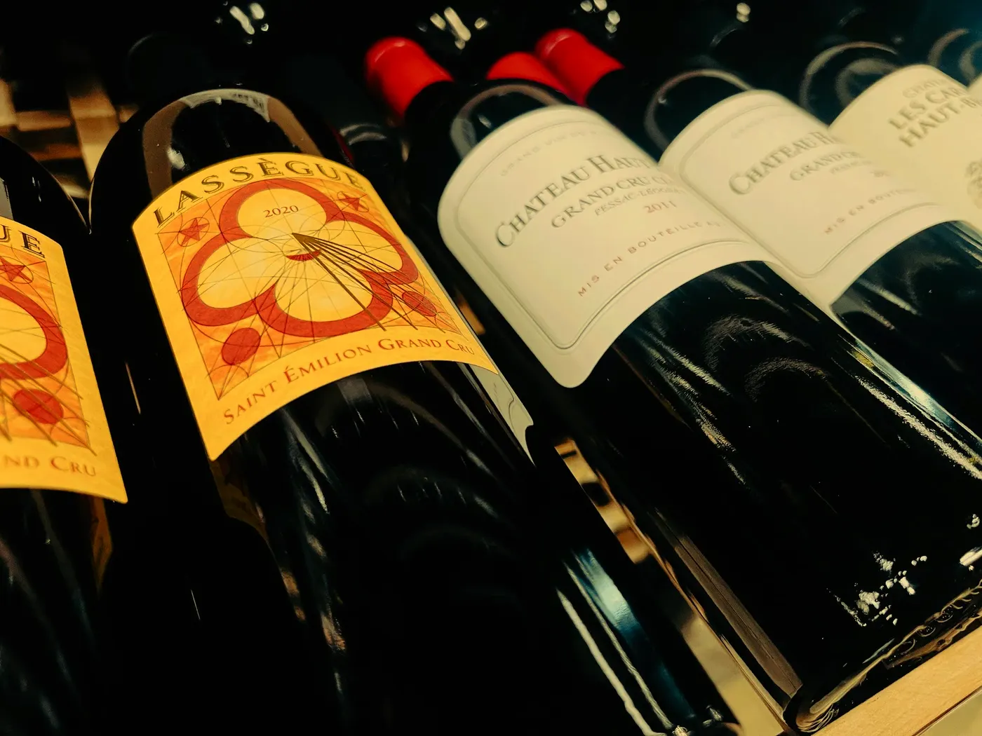 Red wine bottles lying on their sides
