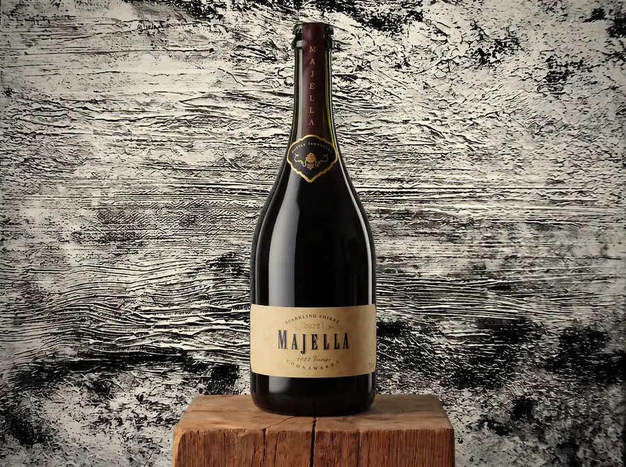 A bottle of Majella Sparkling Shiraz on a wooden block